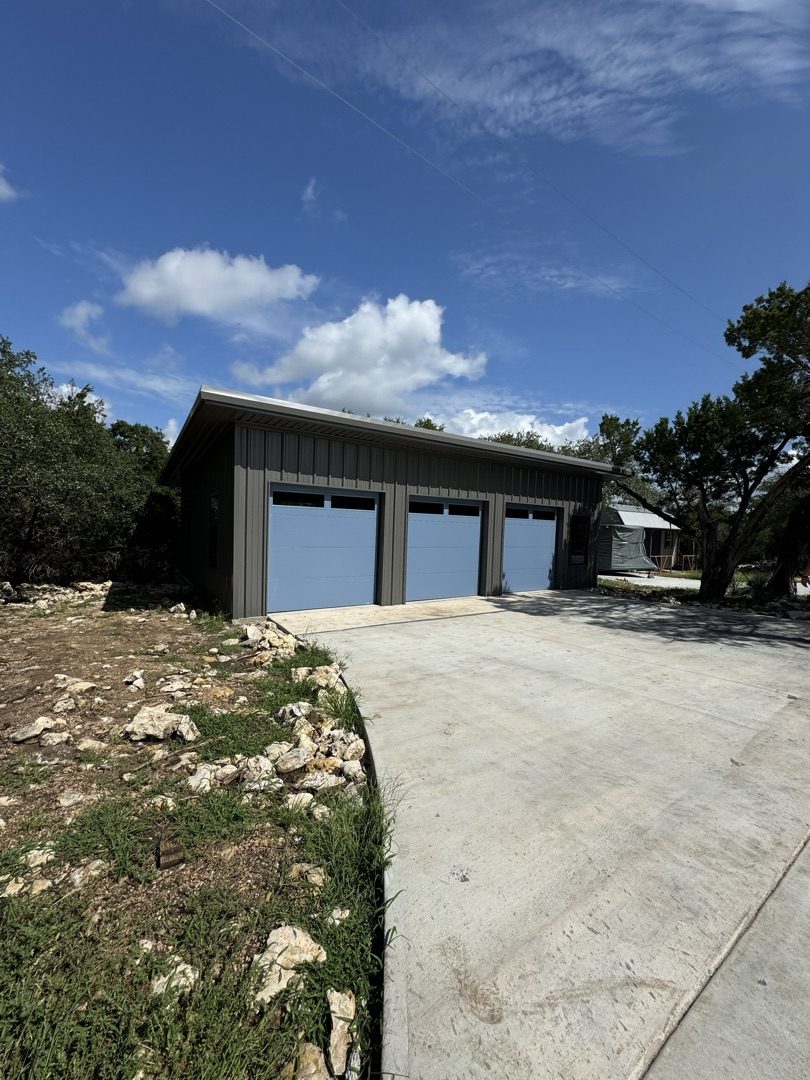 3-bay metal garage with concrete driveway, Central Texas