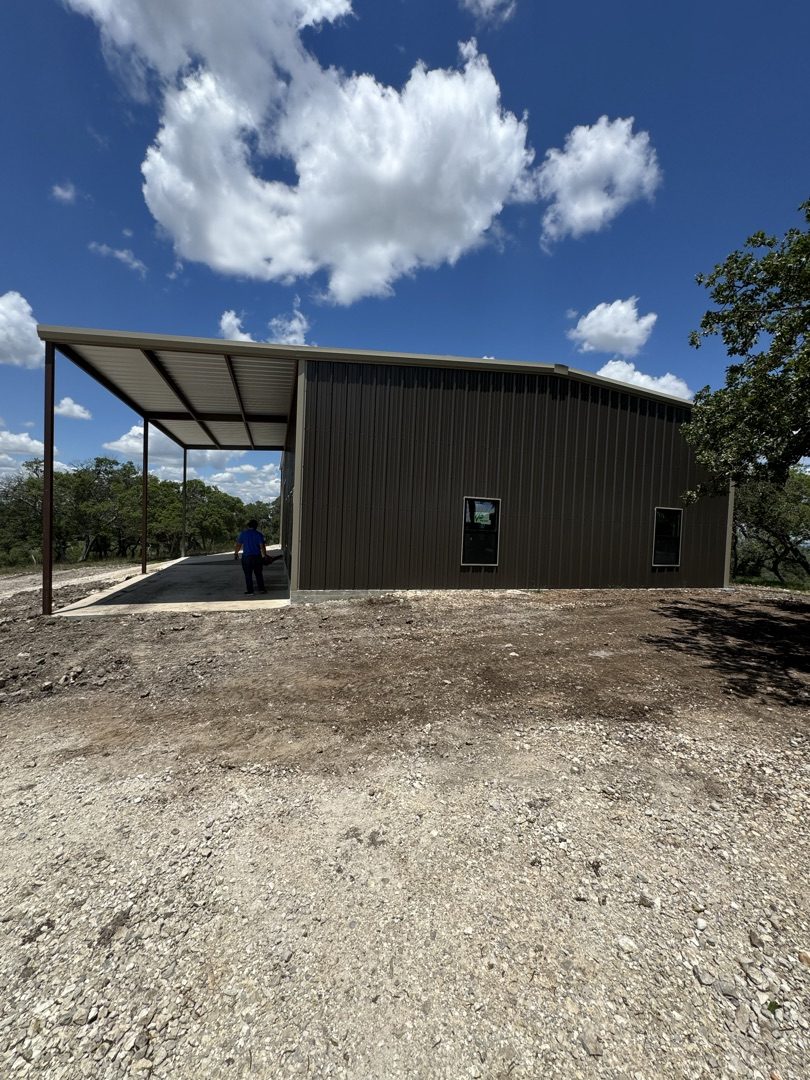 Brown metal barn with awning, Central Texas