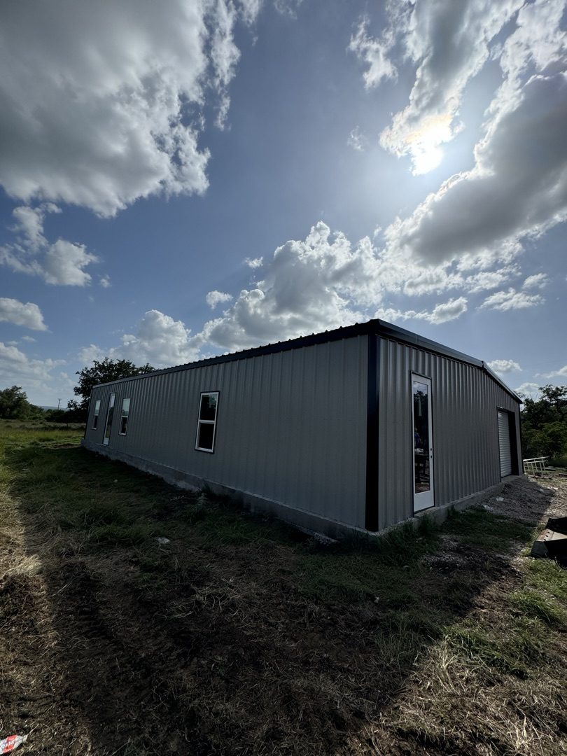 Steel building with sun flare, Central Texas