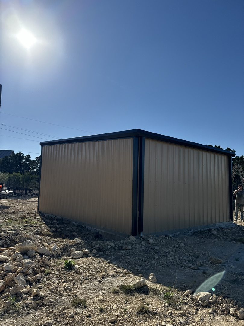 Tan and black metal building
