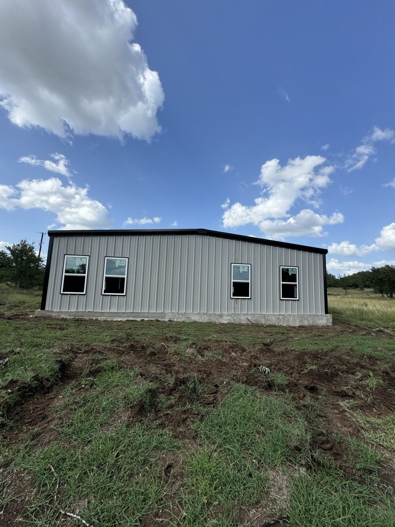 White metal building with windows, Canyon Lake TX